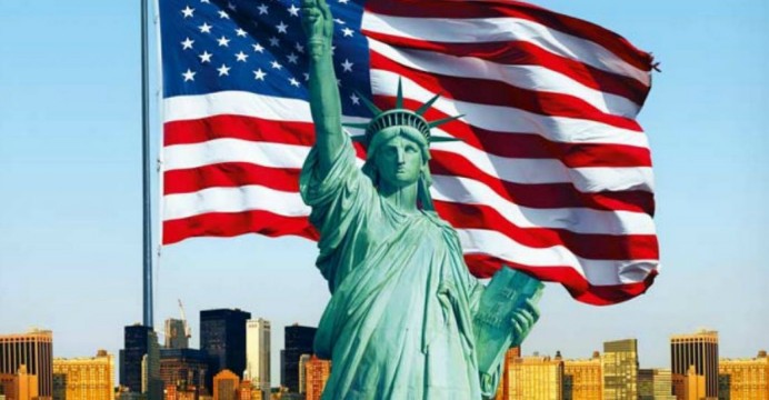 Statue of Liberty in from of US flag