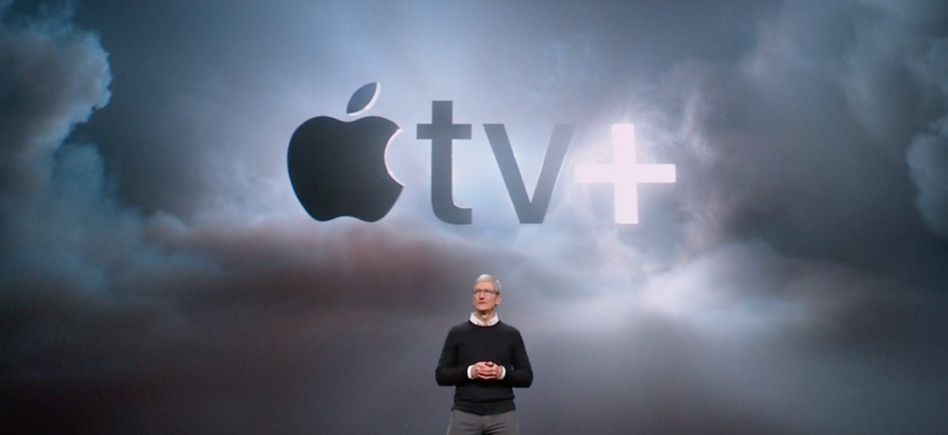 Tim Cook at the Apple launch event with the Apple TV Plus logo in the background