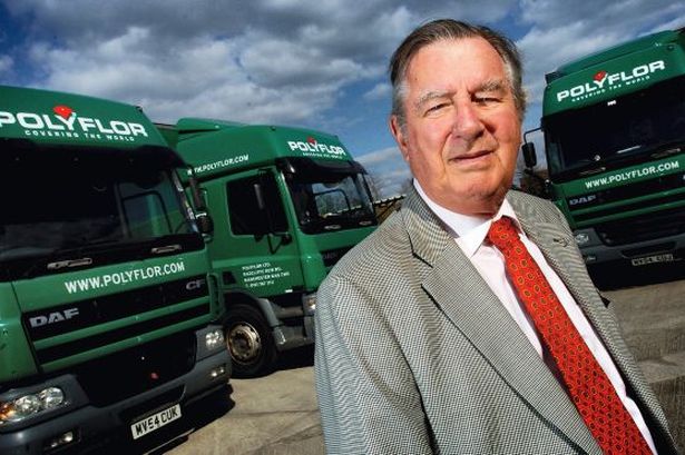 James Halstead standing in front of the company's lorries 