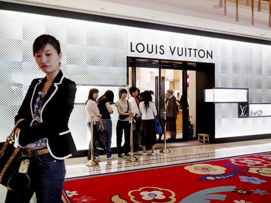 A queue of people outside a Louis Vuitton store in China
