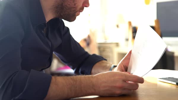 A man carefully reads through company results