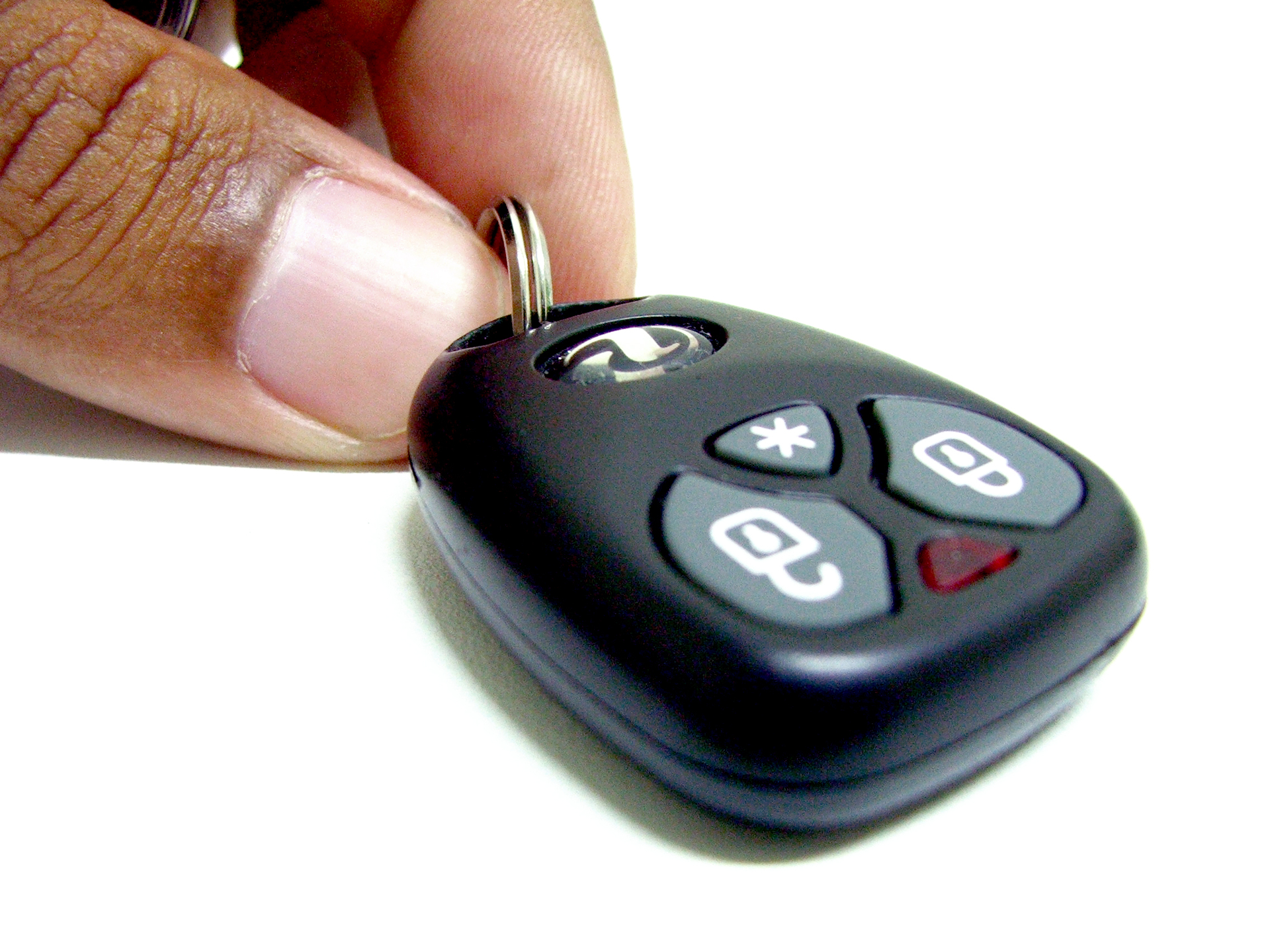 Person holding alarm key fob