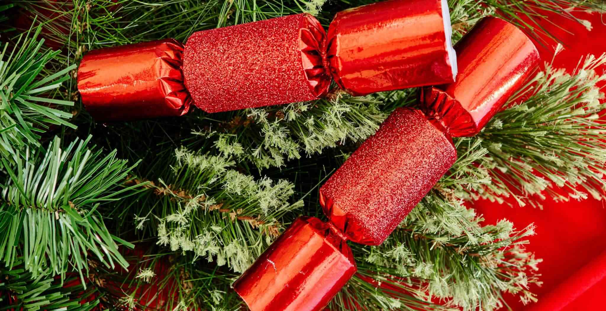 Two red Christmas crackers in a tree